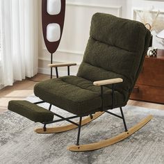 a rocking chair and ottoman in a living room