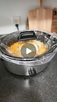 an open crock pot with some food in it