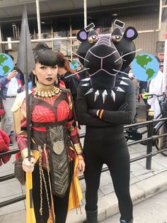 two people in costumes standing next to each other