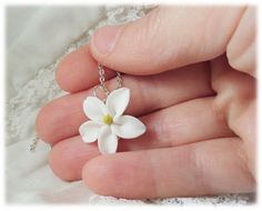 Petite hand sculpted 2cm White Jasmine pendant on a hand wired bail. Available in many colors. -Original hand sculpted polymer clay flowers -Durable, water-resistant -No molds, no paint, no glue -2cm Flower (about 3/4 inch) -16 inch or 18 inch chain -Silver-plated, Gold-plated, Antique Brass, 925 sterling Silver or 14k Gold Filled View matching collection at: https://www.etsy.com/shop/strandedtreasures/search?search_query=jasmine Flowers are hand sculpted without molds or paint using polymer cla Jasmine Flower Necklace, Clay Flower Keychain, White Polymer Clay Pendant Jewelry, 3d Petal Shaped Floral Jewelry Gift, Handmade Polymer Clay Jewelry With Flower Pendant, Handmade Polymer Clay Flower Pendant Jewelry, Small Polymer Clay Jewelry As Gift, Unique White Jewelry With Flower Charm, Unique 3d Flower Jewelry