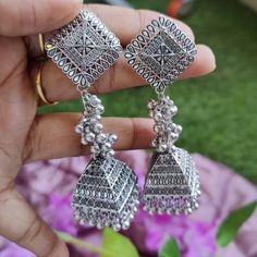 Overview: This Earrings set will leave you Amazed for sure. These have excellent finish and gives out an exquisite sense of style. this certainly is for special occasions such as Anniversary, Engagement, Party, Wedding or for gifting. Item Description: Material: German Silver suitable for all kinds of dressy occasions OCCASION: PARTY WEAR , WEDDING, MARRIAGES, CASUAL, DAILY WEAR Best Suited for Gifting Care : For the longevity of your ornaments: ▪Dos 1)Before keeping the ornaments back in the pa Bohemian Metal Jhumkas, Bohemian Oxidized Jhumkas For Gift, Bohemian Oxidized Jhumkas As Gift, Festive Bohemian Jhumkas, Festive Bohemian Chandelier Earrings With Intricate Design, Traditional Nickel-free Danglers, Bohemian Oxidized Chandelier Earrings For Wedding, Bohemian Metal Jhumkas As Gift, Bohemian Metal Jhumkas With Intricate Design