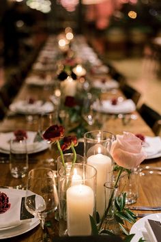 a long table is set with candles and flowers on it for a formal dinner party