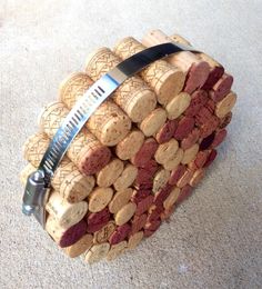 a bunch of wine corks with a knife stuck in it's center piece