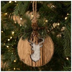 a wooden ornament hanging from a christmas tree