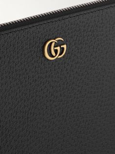 Part of Gucci's 'GG Marmont' range, this pouch is a practical option when you just need the essentials. Punctuated with gold-tone hardware, it's been made in Italy from full-grain leather and has six internal card slots, so you can forgo a wallet. Detach the strap for a more streamlined look. Luxury Textured Leather Clutch For Daily Use, Classic Leather Wallet With Metal Logo, Classic Gucci Bags With Gold-tone Logo Plaque, Luxury Leather Wallets With Metal Logo, Designer Bags With Grained Texture For Everyday Use, Luxury Leather Wallet With Grained Texture, Leather Wallets With Gold-tone Logo For Everyday Use, Designer Clutch Pouch With Gold-tone Hardware, Luxury Wallets With Grained Texture For Formal Occasions