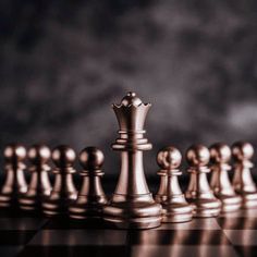 a group of chess pieces sitting on top of a table