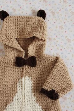 a crocheted teddy bear jacket with black ears