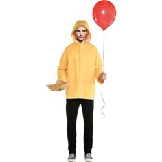 a man in a yellow raincoat holding a red balloon and wearing a mask on his face