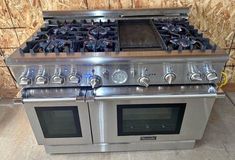 a stainless steel stove with two ovens on it