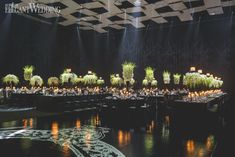 an elaborately decorated banquet hall with chandeliers and tables set up for a formal function