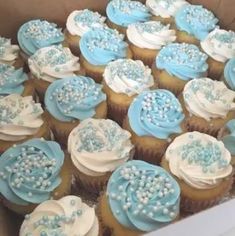 cupcakes with blue and white frosting on them