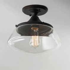 a light fixture with a clear glass shade