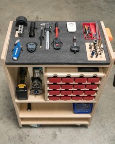 a workbench with tools and other items on it