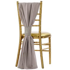 gold chiavar chair with silver drape and diamond sashing on the back