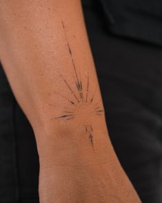 a person with a tattoo on their arm