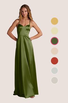 a woman in a long green dress standing next to an assortment of color swatches