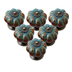 six decorative glass knobs with designs on them