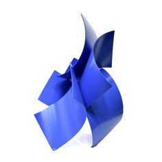 a blue sculpture is shown against a white background and it appears to be folded up