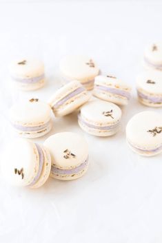 several white macaroons are sitting on the table