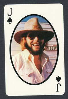 a man wearing a hat and sunglasses in a playing card