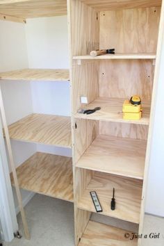 the shelves are made out of wood and have tools on them