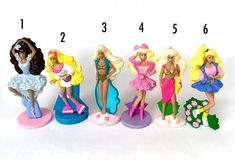 there are five different barbie dolls on the same stand, each with their own name