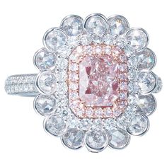 the characteristics for the described diamond jewelry with GIA Certification Number 5221633363: Style: SG-8280 Colour Grade: Light Pinkish Brown Center Stone:1.01 ct Radiant Carat Weight: 0.60 ct (rose cut) Rose Cut White Diamond: 16pcs Round White Diamonds: Carat Weight: 0.50 carats (71 pieces) Fancy Pink Small Diamonds: Carat Weight: 0.11 carats (22 pieces) Total Weight: 7.458 gms This jewelry piece is characterized by its exquisite light pinkish brown center stone, which is a 1.01-carat rose- Luxury Pink Flower Shaped Ring, Mens Pink Diamond Ring, Luxury Pink Baguette Cut Jewelry, Pink Diamond Ring, Radiant Cut, Gorgeous Jewelry, Rose Cut Diamond, Pink Diamond, White Diamonds