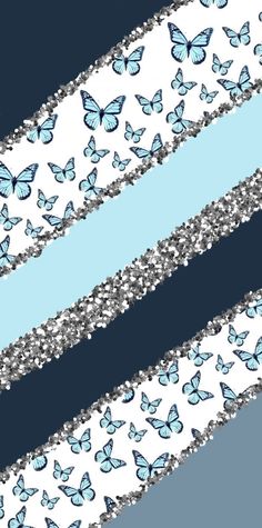 blue and white butterflies with silver glitters on them are flying in the air over a black background