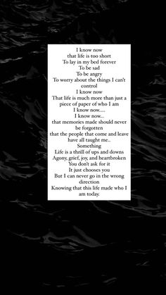 a poem written in black and white on the side of a dark background with water