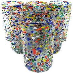 multicolored glass tumblers are lined up together