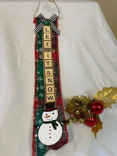 a christmas stocking with a snowman decoration on it