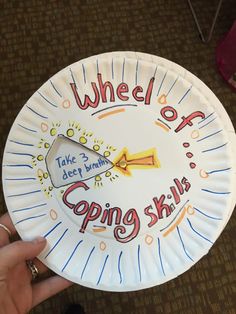 a paper plate with the words wheel of going ski written on it