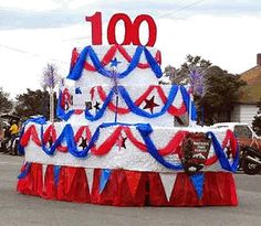 a large cake with red, white and blue decorations