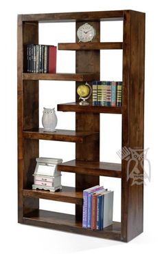 a book shelf with several books on it and a clock in the corner next to it