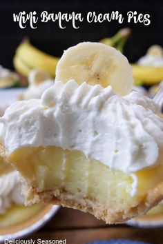 a banana cream pie is being held up by a fork with the rest of it