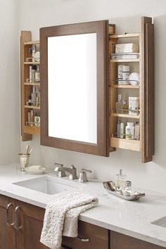 a bathroom with two sinks and a medicine cabinet