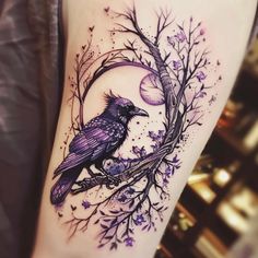 a purple bird sitting on top of a tree branch next to a moon and stars