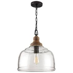 a glass light fixture hanging from the ceiling