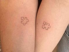 two people with matching tattoos on their legs, one has a puzzle piece tattooed on the other