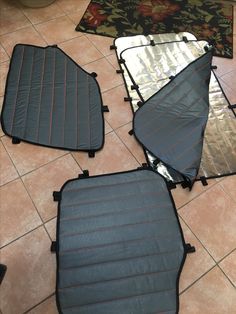 four pieces of luggage sitting on the floor