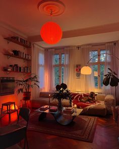 a living room filled with furniture and lots of windows