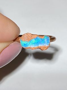 Beautiful electroformed Raw Australian opal ring using recycled copper Deep green and blue fire A genuine natural solid opal (not a doublet, triplet, inlay or synthetic opal) Stone size measures: 10.6 x 5.5 mm    Direct from an opal mining family :) Size: 4 US The one you see is the one you will receive Thanks for looking! Caring for electroformed jewellery: Due to the nature of its creation electroformed jewellery is not as robust as other forms of jewellery. It is recommended that your piece b Handmade Iridescent Opal Ring, Spiritual Multi-stone Opal Ring, Solid Opal Ring, Gold Adjustable Opal Ring, Round Shape, Dendrite Opal, Adjustable Opal Crystal Ring, Oval Shape, Raw Opal Ring, Australian Opal Ring, Raw Opal