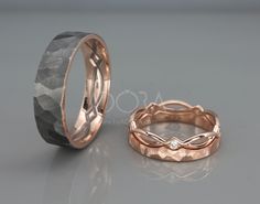 two wedding bands made out of rose gold and black diamond, one with an intricate design