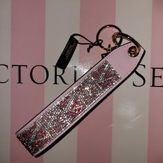 Brand New With Tag Victoria Secret Wristlet Strap With Rhinestones Logo V Limited Edition Attaches To Totes, Backpacks, Or Can Be Used Separately As Keychain 3"L X 6 3/4"H Price Firm Pet Free Smoke Free Home Happy Shopping Victoria Secret Wristlet, Leopard Bucket Hat, Coin Purse Keychain, Flat Top Sunglasses, Backpack Keychains, Monogram Towels, Head Wrap Scarf, Soft Sock, Mini Wallet