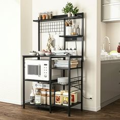 a kitchen with a microwave and other items on the shelf in front of the stove