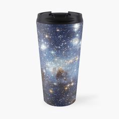 a blue and white travel mug with an intricate design on the front, featuring stars