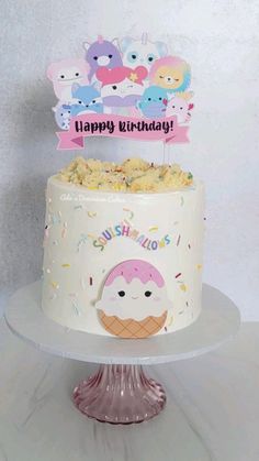 a birthday cake with an ice cream cone on top