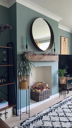 a living room filled with furniture and a large mirror on the wall above a fire place