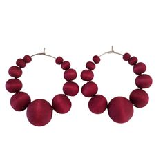 Introducing the Burgundy Majestic Hoop Earrings - a bold statement piece that adds flair to any outfit. These wooden beaded hoops, crafted with a matte burgundy finish, offer a rich and warm tone, perfect for enhancing your everyday look or elevating your style for a night out. The deep burgundy color symbolizes sophistication and elegance, making it versatile for any occasion. Despite their chunky and substantial appearance, these earrings are incredibly lightweight, ensuring all-day comfort. Made with nickel-free, hypoallergenic stainless steel wire, they're gentle on sensitive ears, providing both style and comfort. Whether you're dressing up or down, these wooden hoops are the ideal accessory for multiple looks. Material: The earrings are made of matte dyed black wood, which gives them Red Hypoallergenic Round Bead Earrings, Red Round Ceremonial Earrings, Cheap Red Statement Hoop Earrings, Red Round Earrings With Polished Finish, Red Faceted Beads Round Earrings, Light Activities, Deep Burgundy, Wooden Hoop, Beaded Hoop Earrings