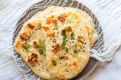 two flat breads are on a plate